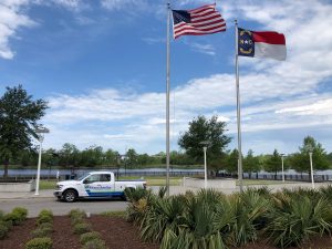 Alliance AutoGas Ford F150 Truck in Front of River with Flags